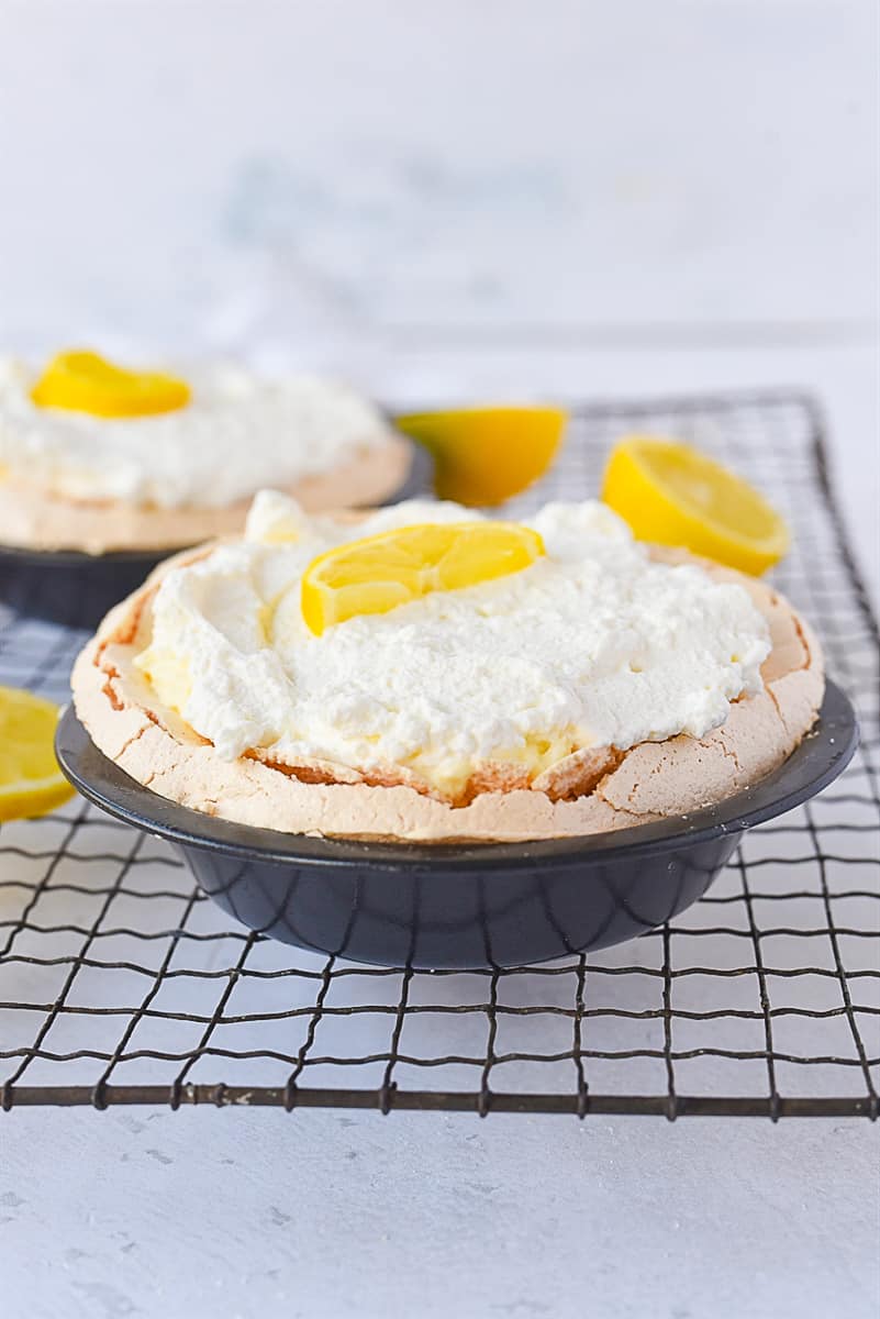 two small lemon angel pies on a cooling rack