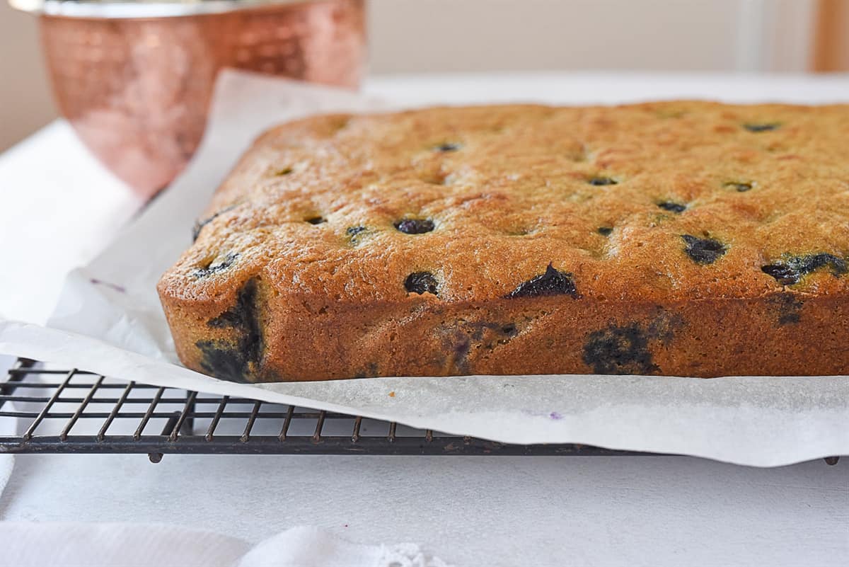 blueberry banana cake cooling on rack