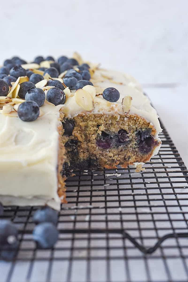 Blueberry banana cake with a piece missing