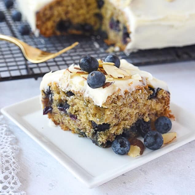 slice of blueberry banana cake on a plate