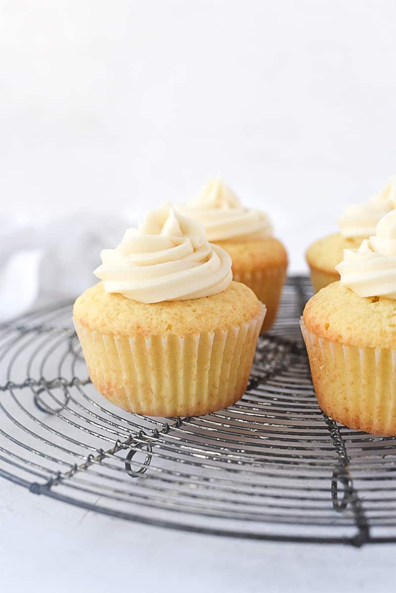 yellow cupcakes on a cooling rack