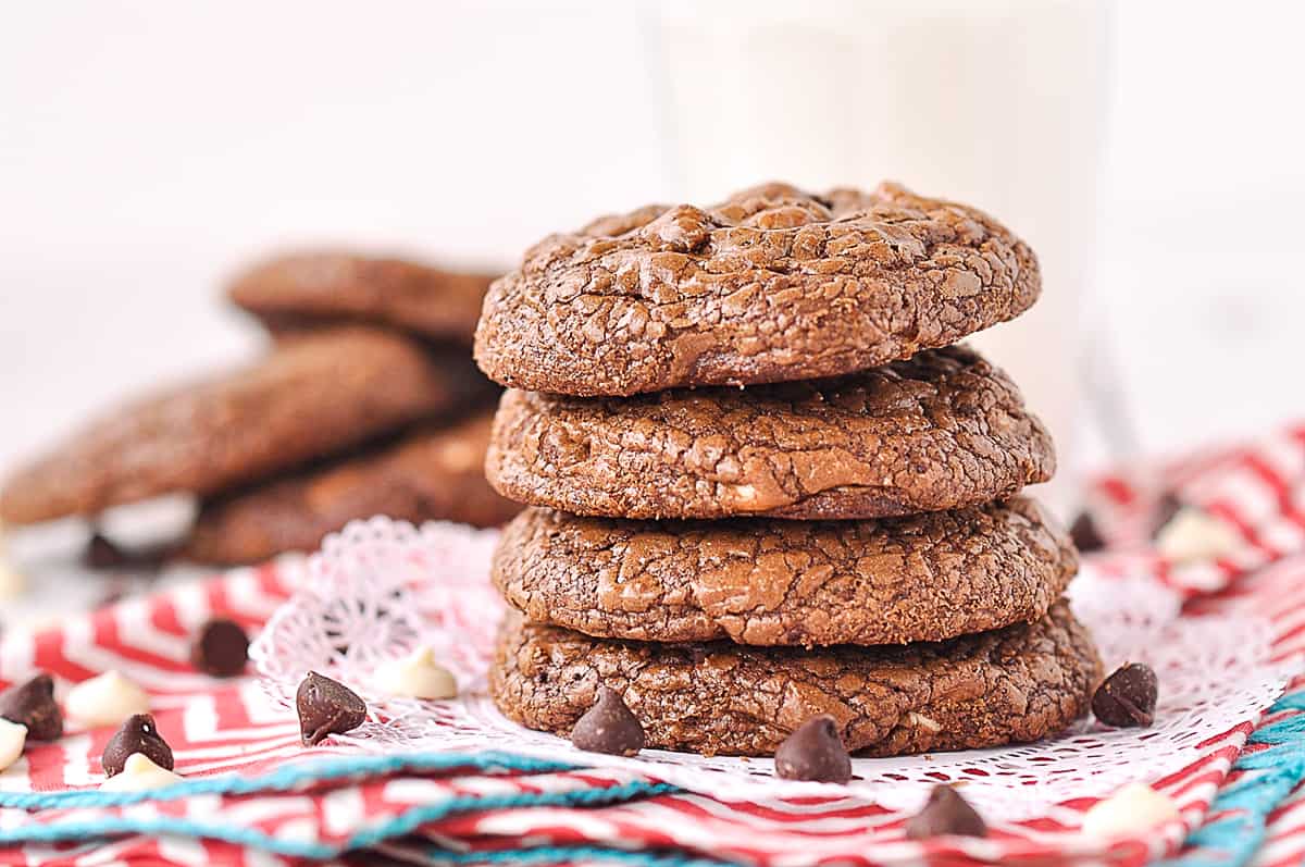 Four triple chocolate cookies in a pile