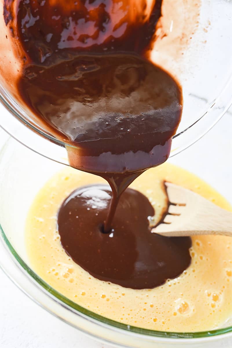 adding chocolate mixture to egg mixture