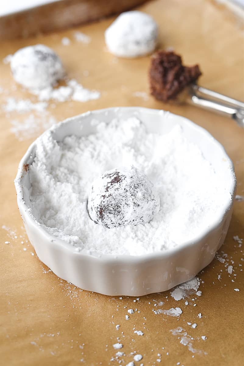 balls of cookie dough in powdered sugar