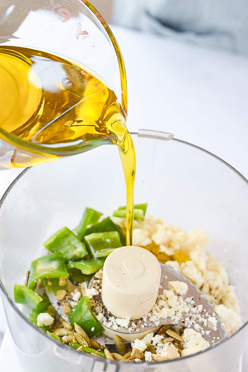 pouring oil into food processor