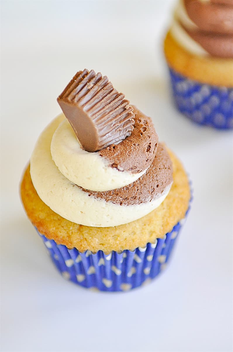 peanut butter cup on top of cupcake