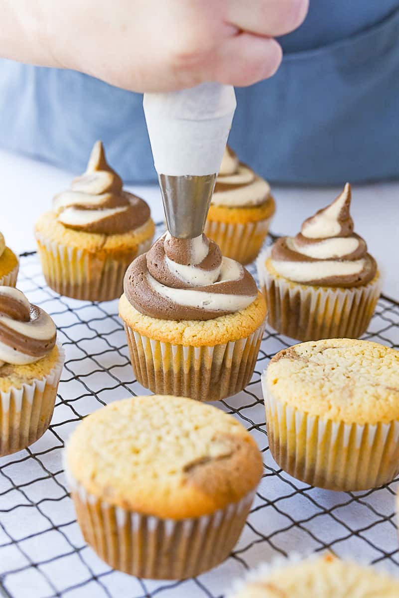 frosting a cupcake