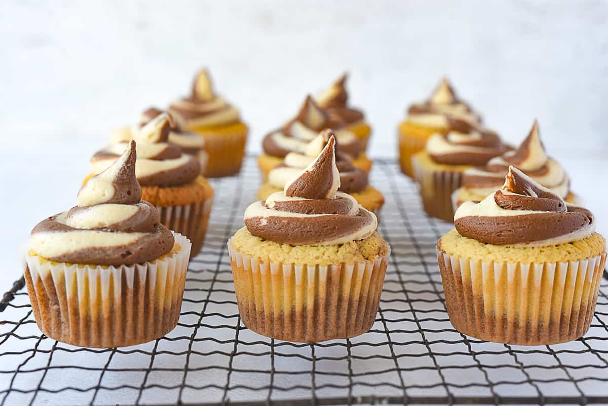 peanut butter chocolate cupcakes on a cooling rack