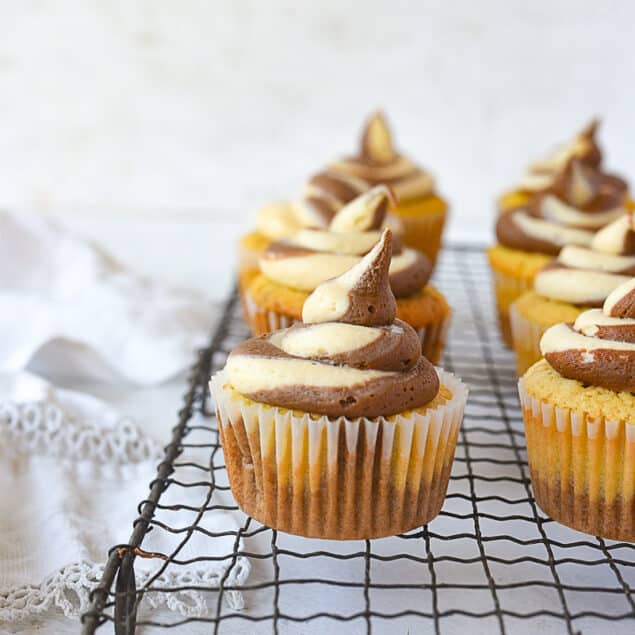 peanut butter chocolate cupcakes on a cooling rack