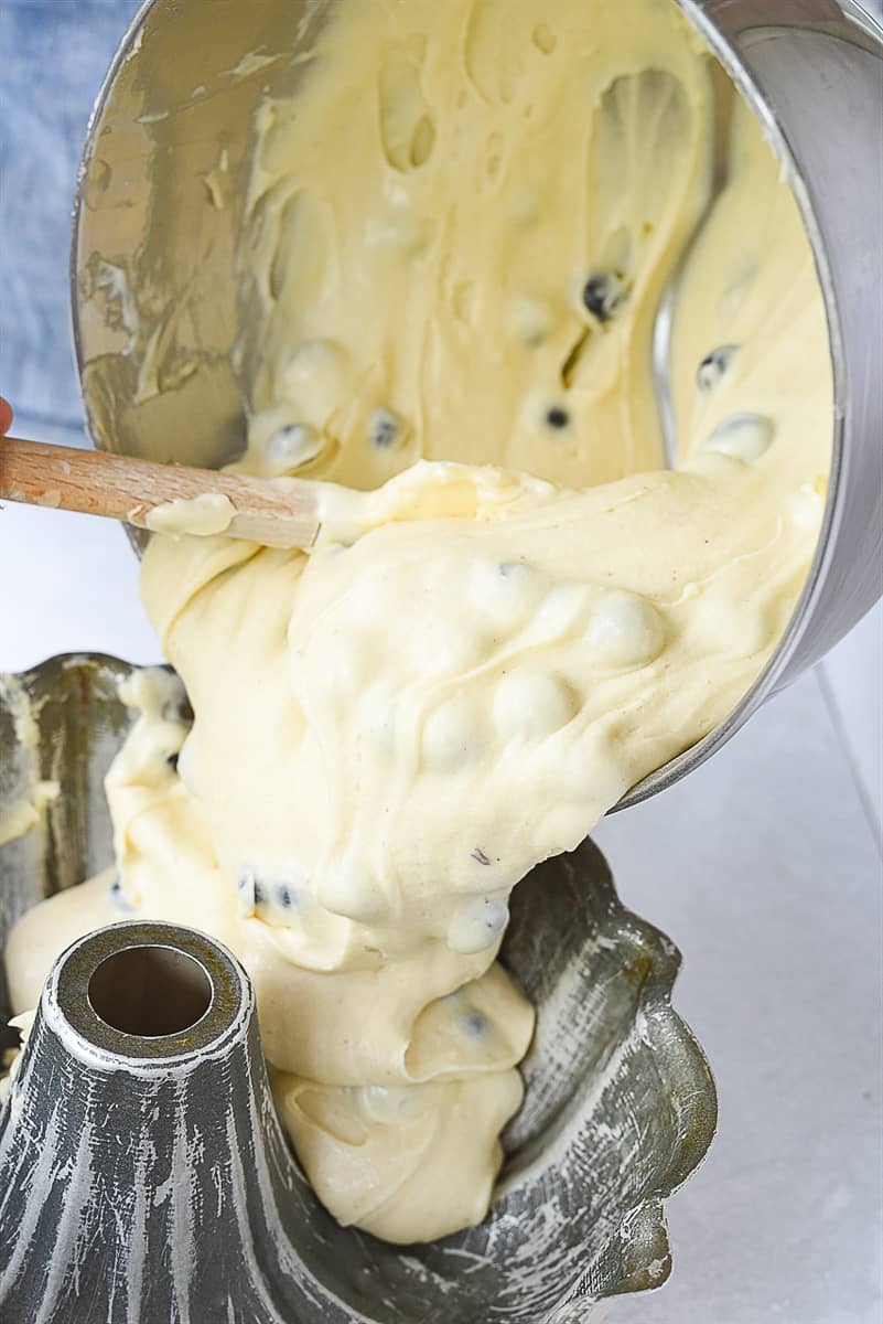 pouring batter into bundt cake pan