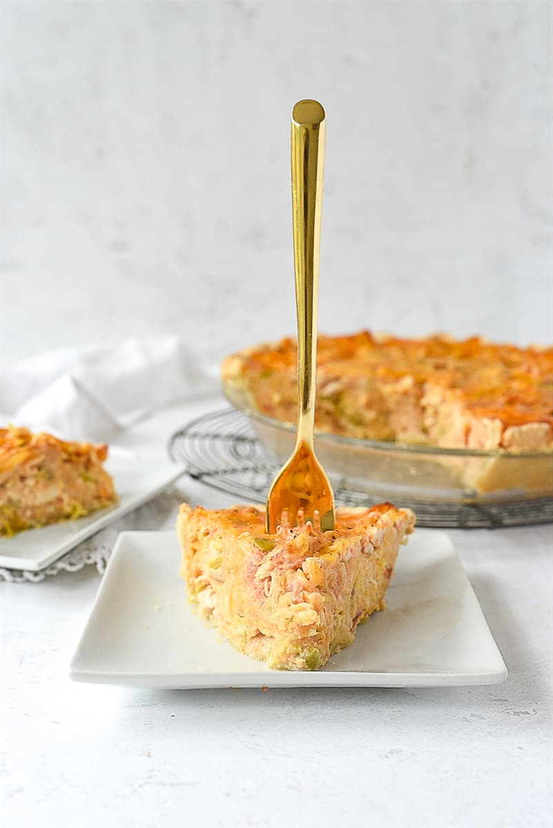 fork in a piece of quiche