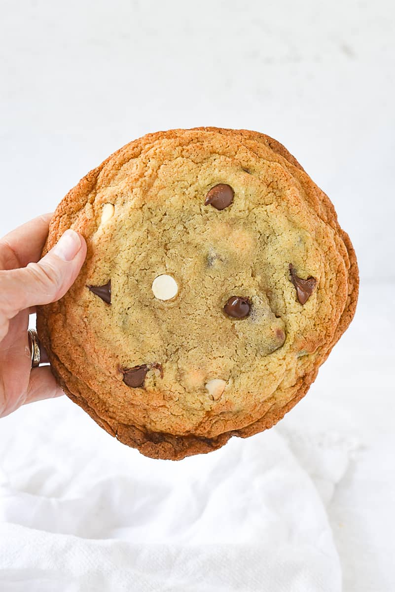 hand holding a chocolate chip cookie