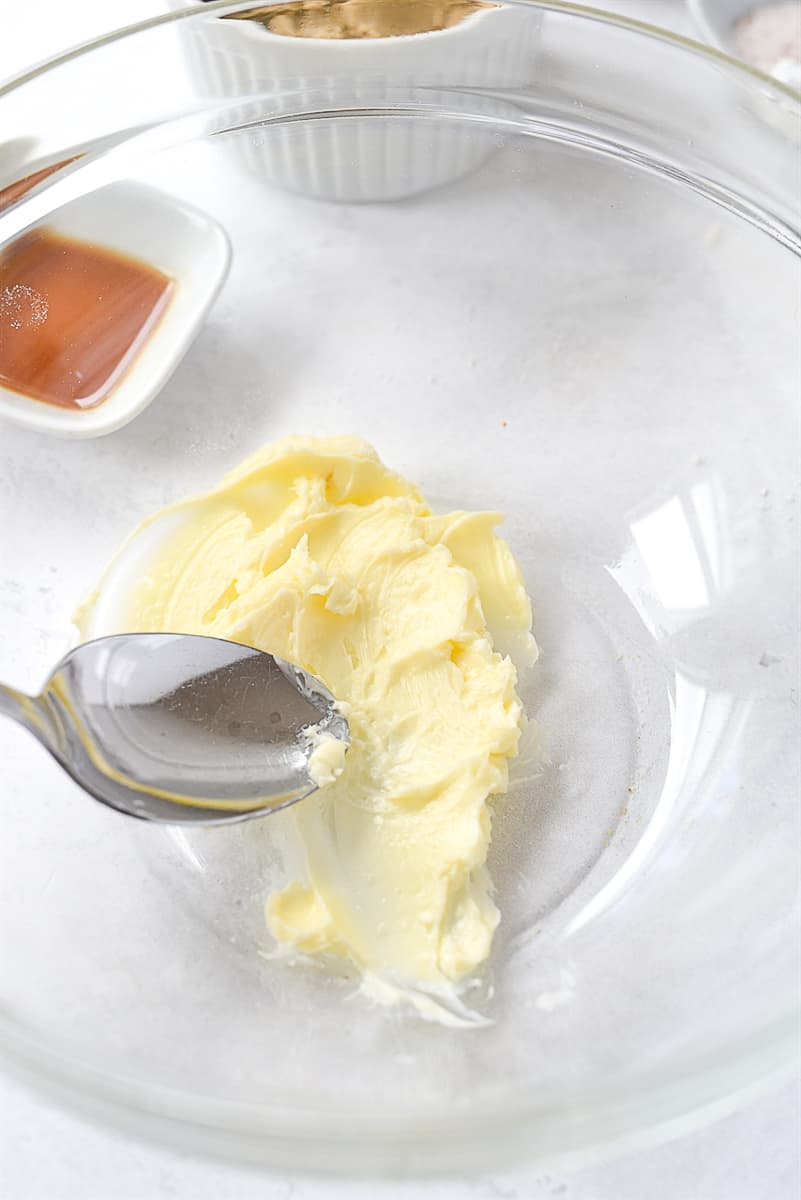 smashing butter with back of spoon.