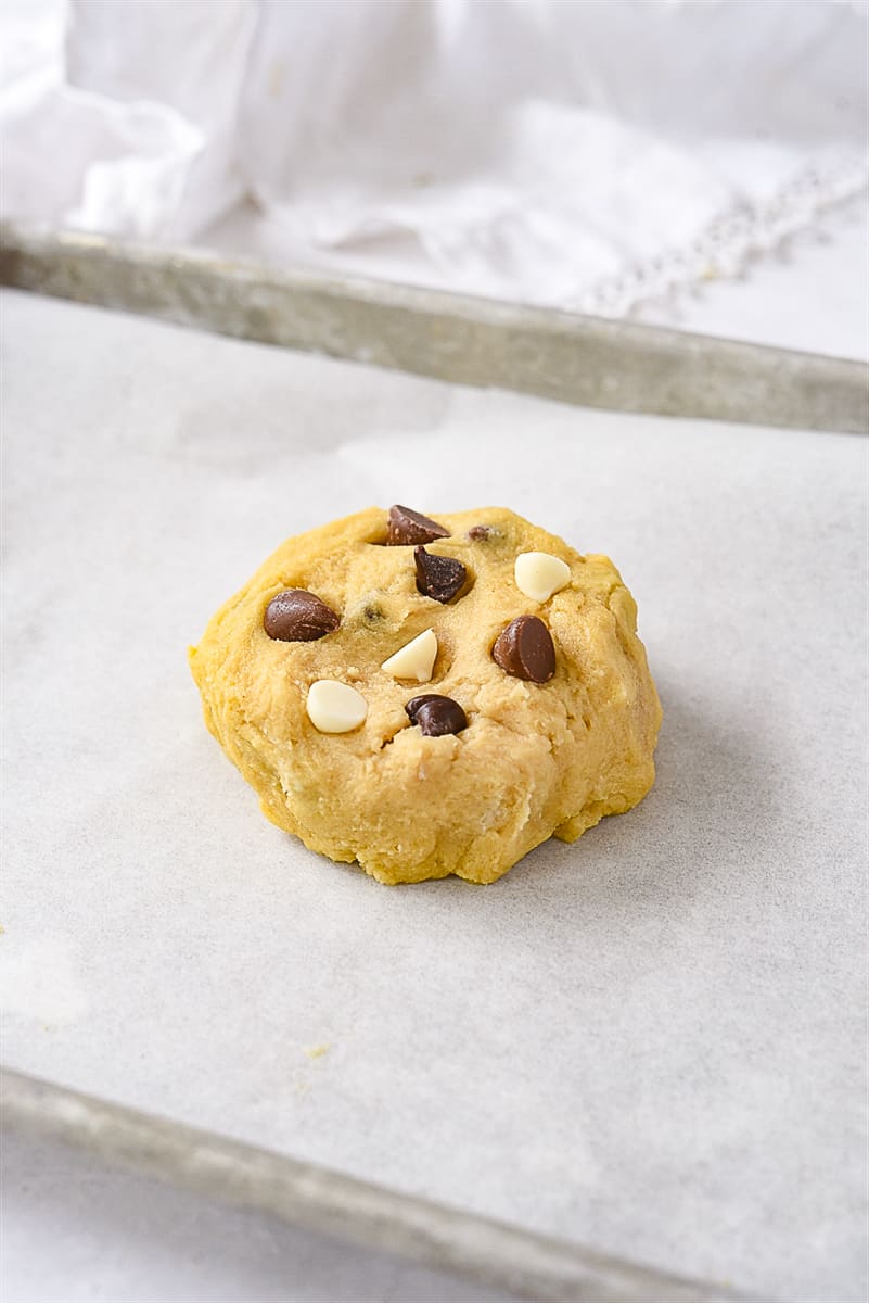 chocolate chip cookie dough on a baking sheet.