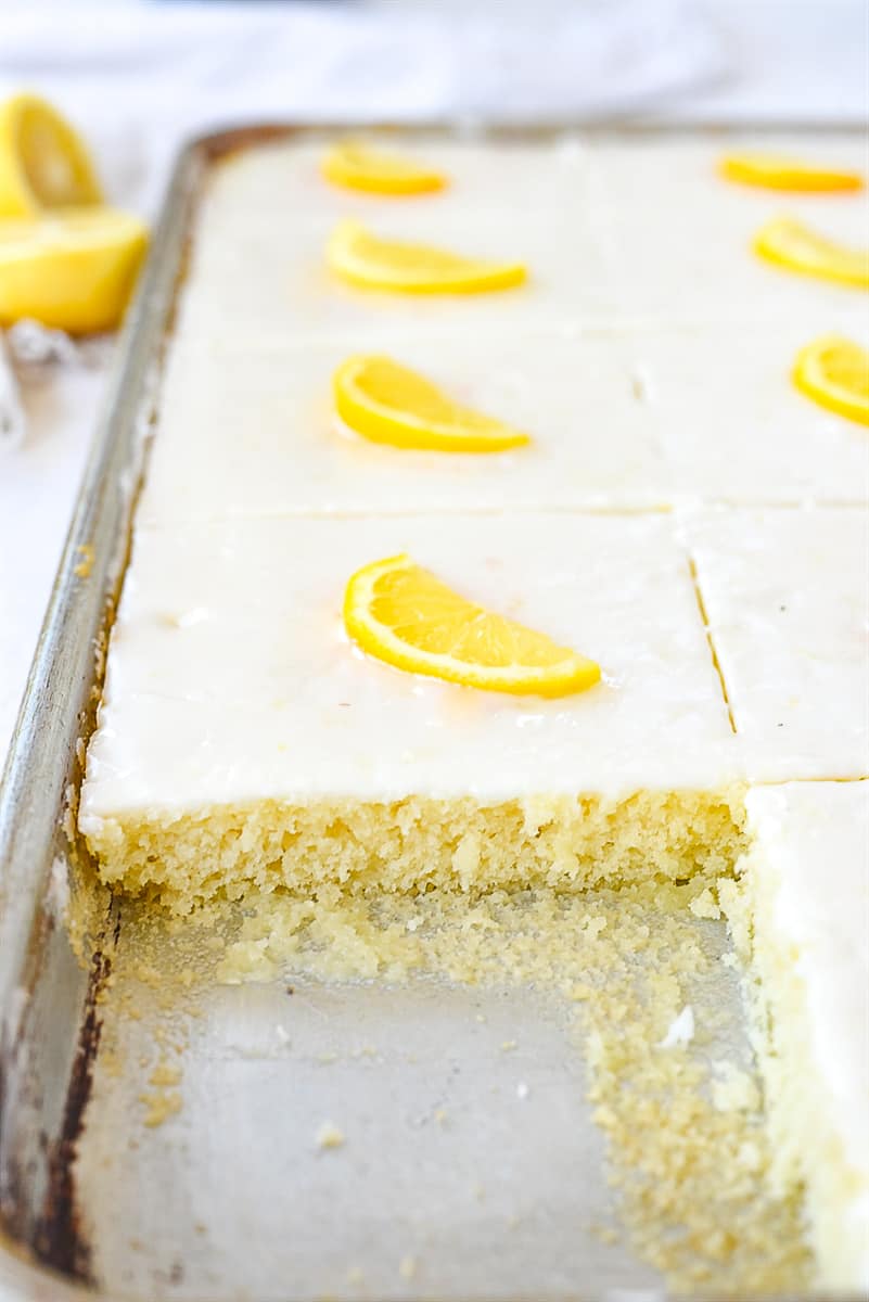 piece of lemon texas sheet cake out of the pan