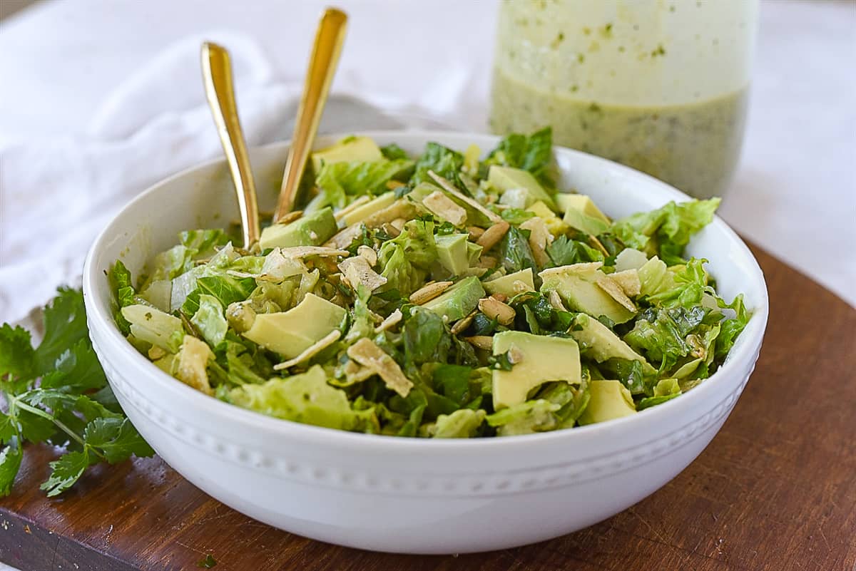 white bowl full of salad