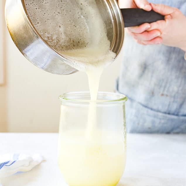 pouring syrup into jar