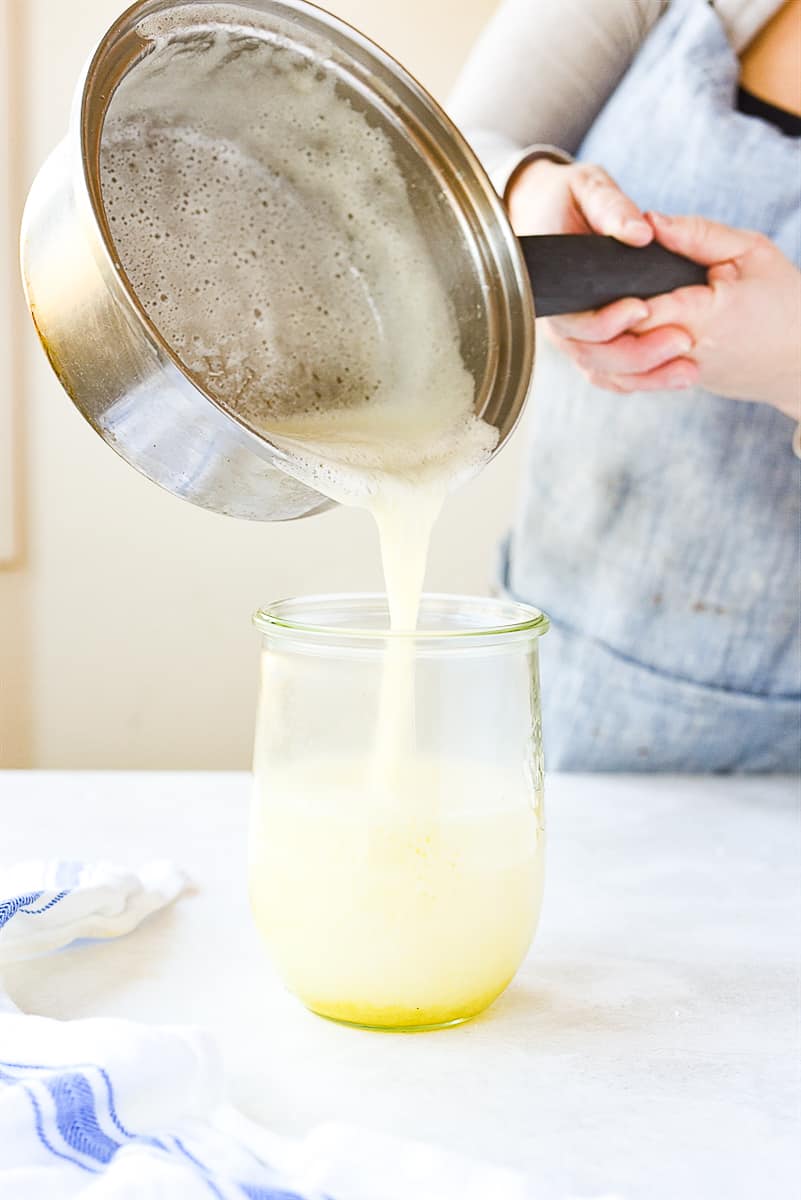 pouring syrup into jar