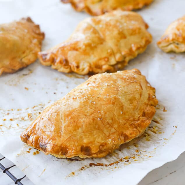 cornishn pastry cooling on parchment paper