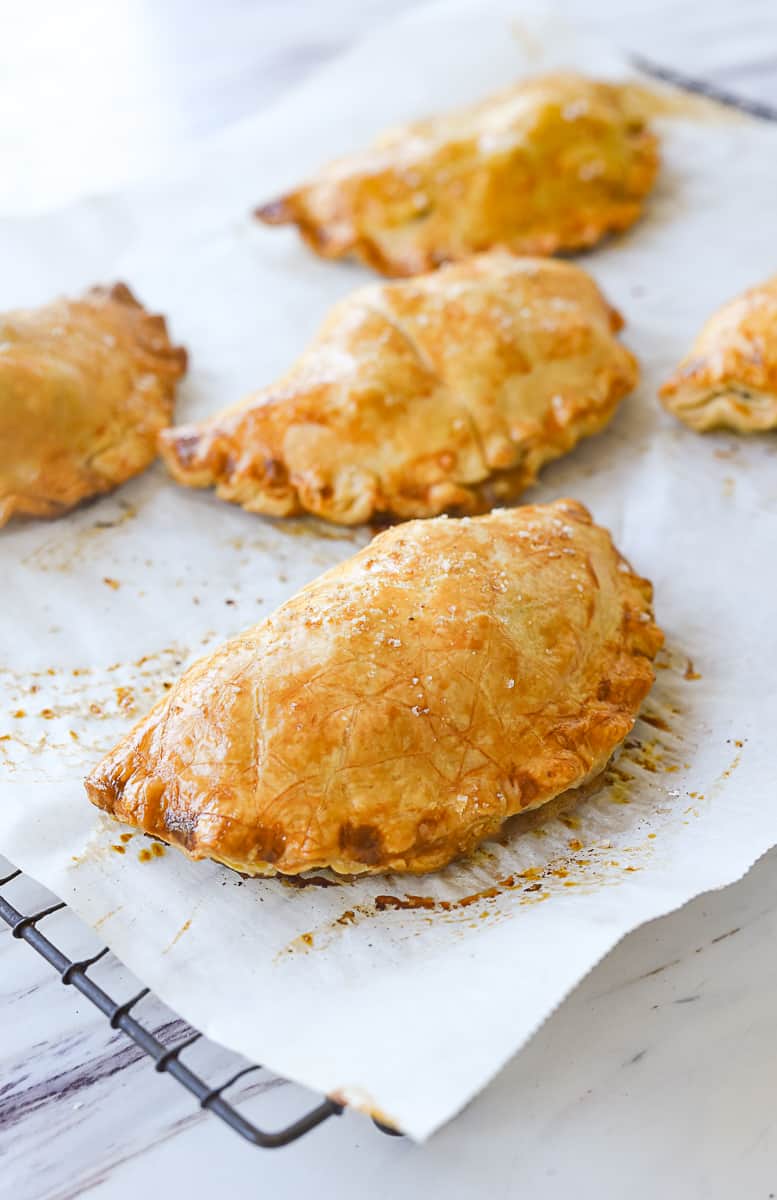 cornishn pastry cooling on parchment paper