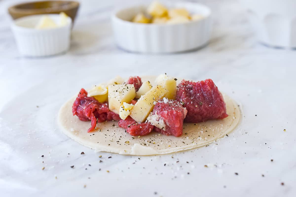 meat and potato on pastry crust