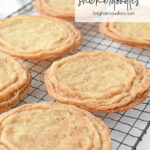 crispy snickerdoodle cookies on a cooling rack