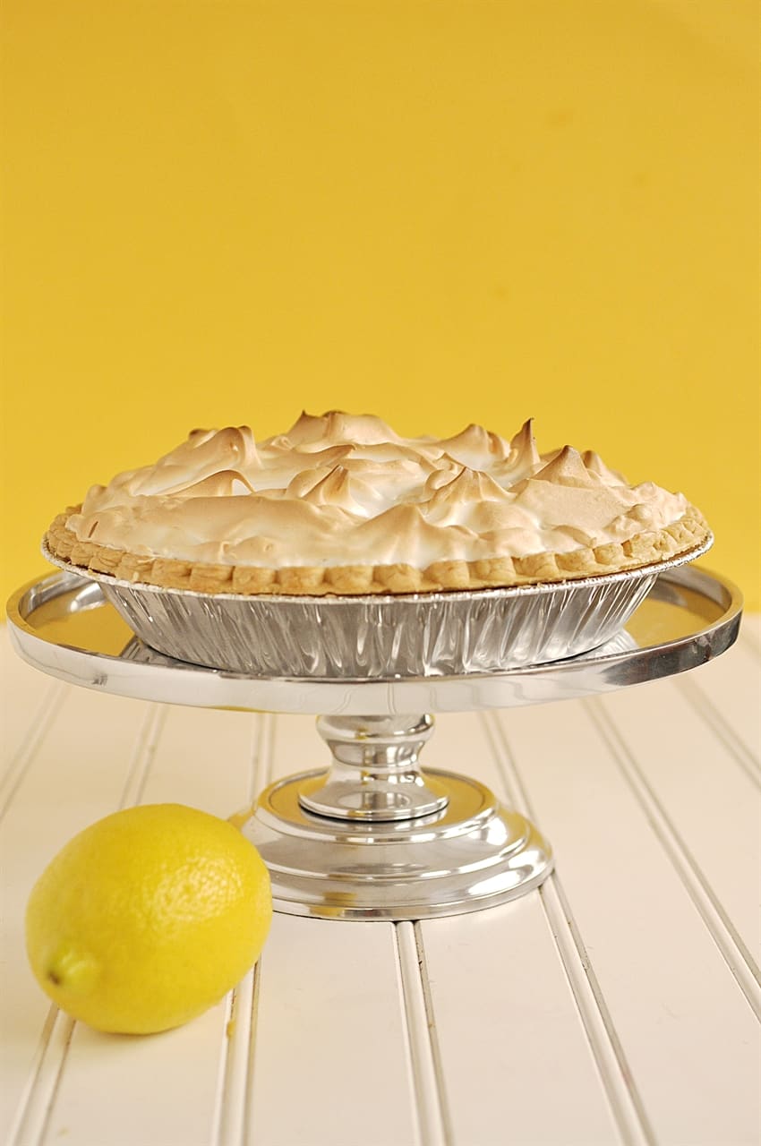 lemon meringue pie on stand