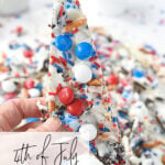 piece of 4th of july cookie bark in a hand