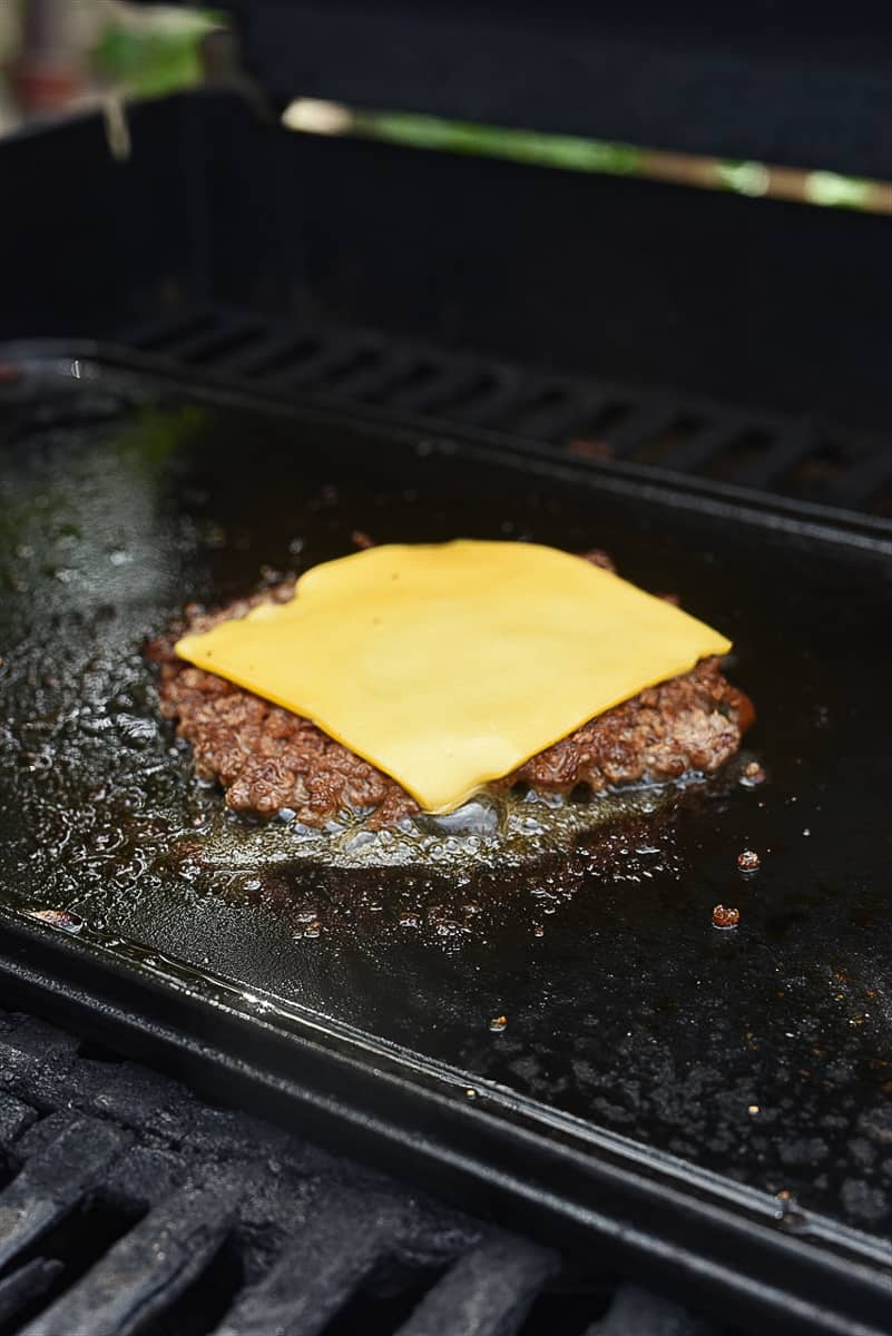 cheese melting on smash burger