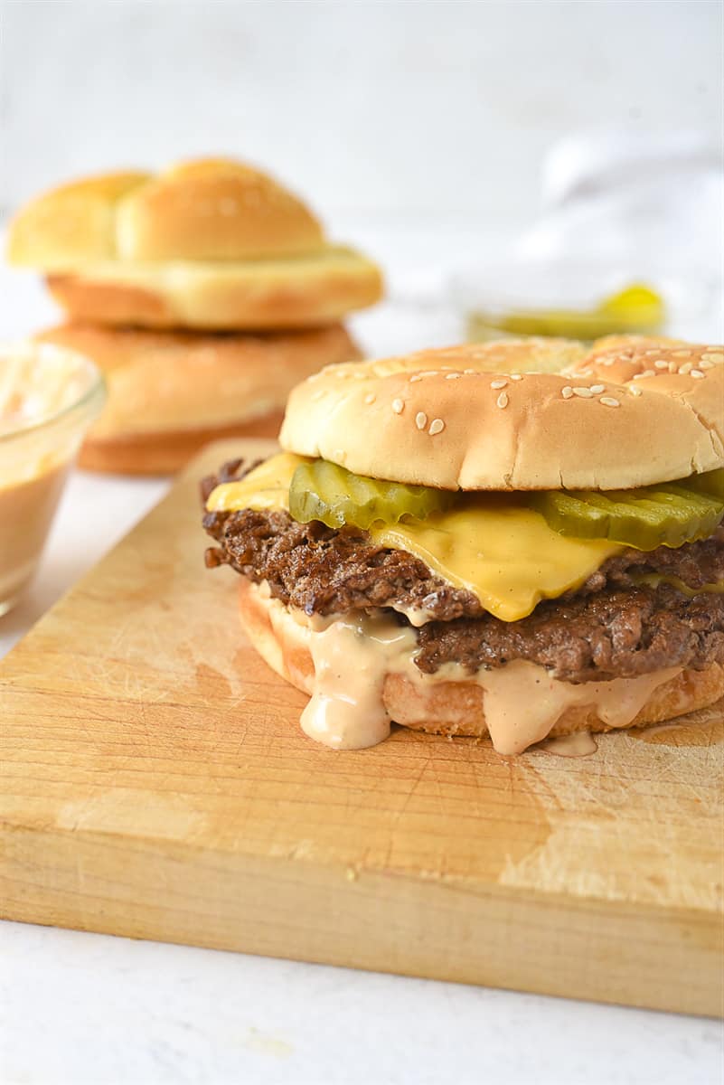 smash burger on a cutting board