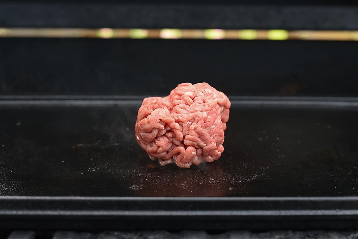 ball of hamburger on griddle