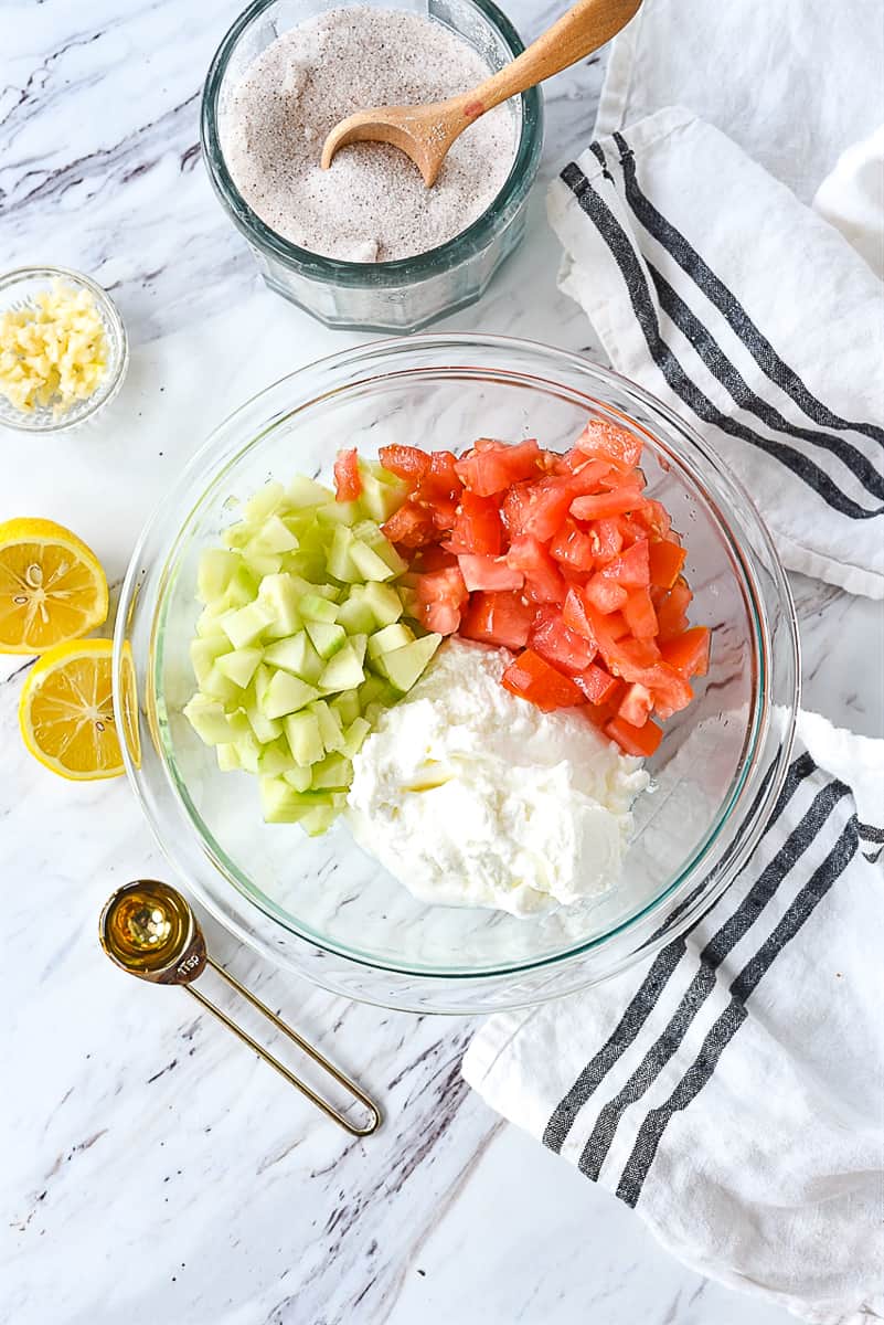 overhead shot of mixing up tzatziki sauce
