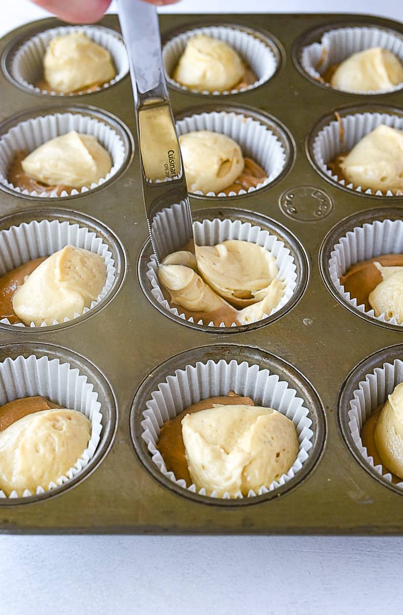 swirling cupcake batter with knife