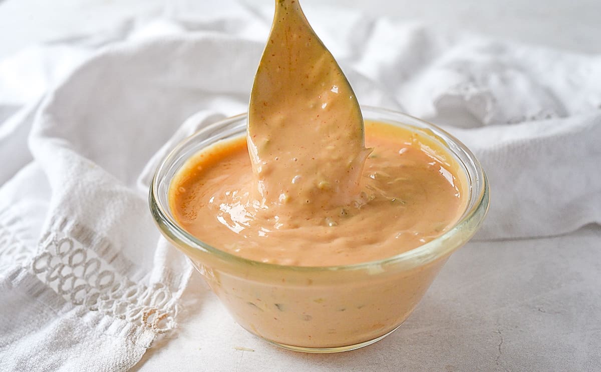 bowl of burger sauce with spoon in it