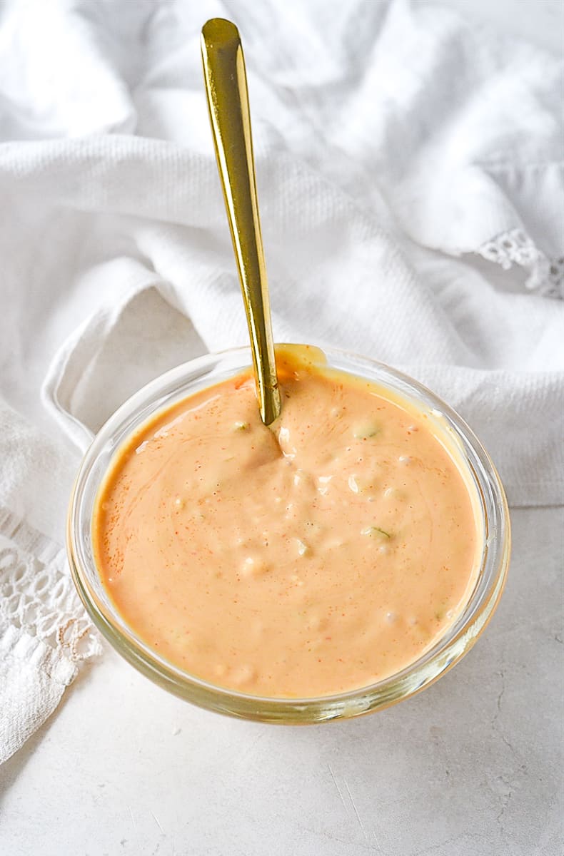 spoon in bowl of burger sauce