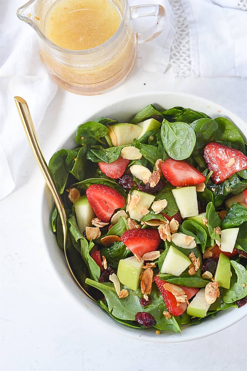 overhead shot of spinach fruit salad