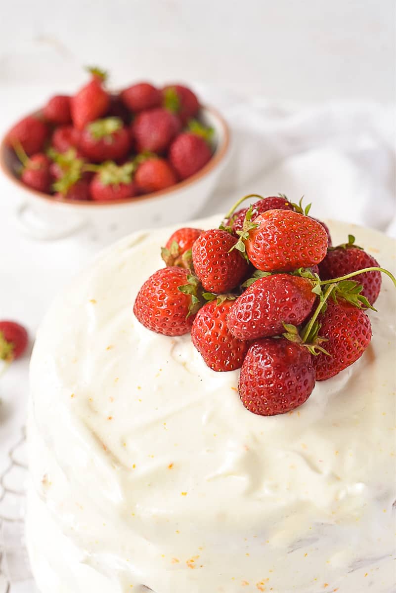 strawberries on top of layer cake