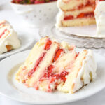piece of strawberry layer cake on plate