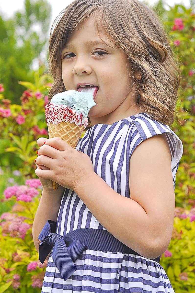 girl licking an ice cream cone