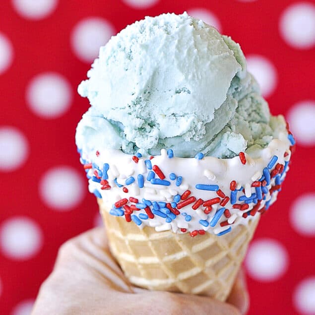 scoop of blue moon ice cream in a cone