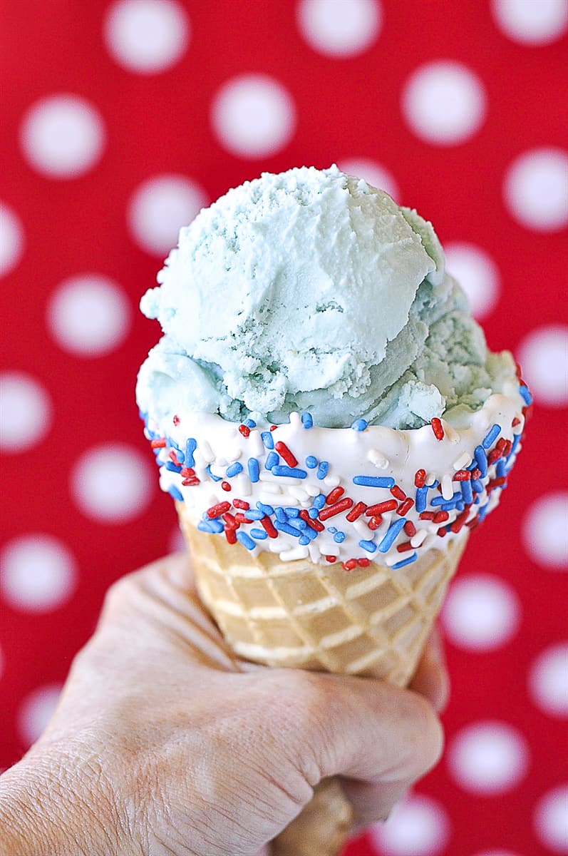 scoop of blue moon ice cream in a cone