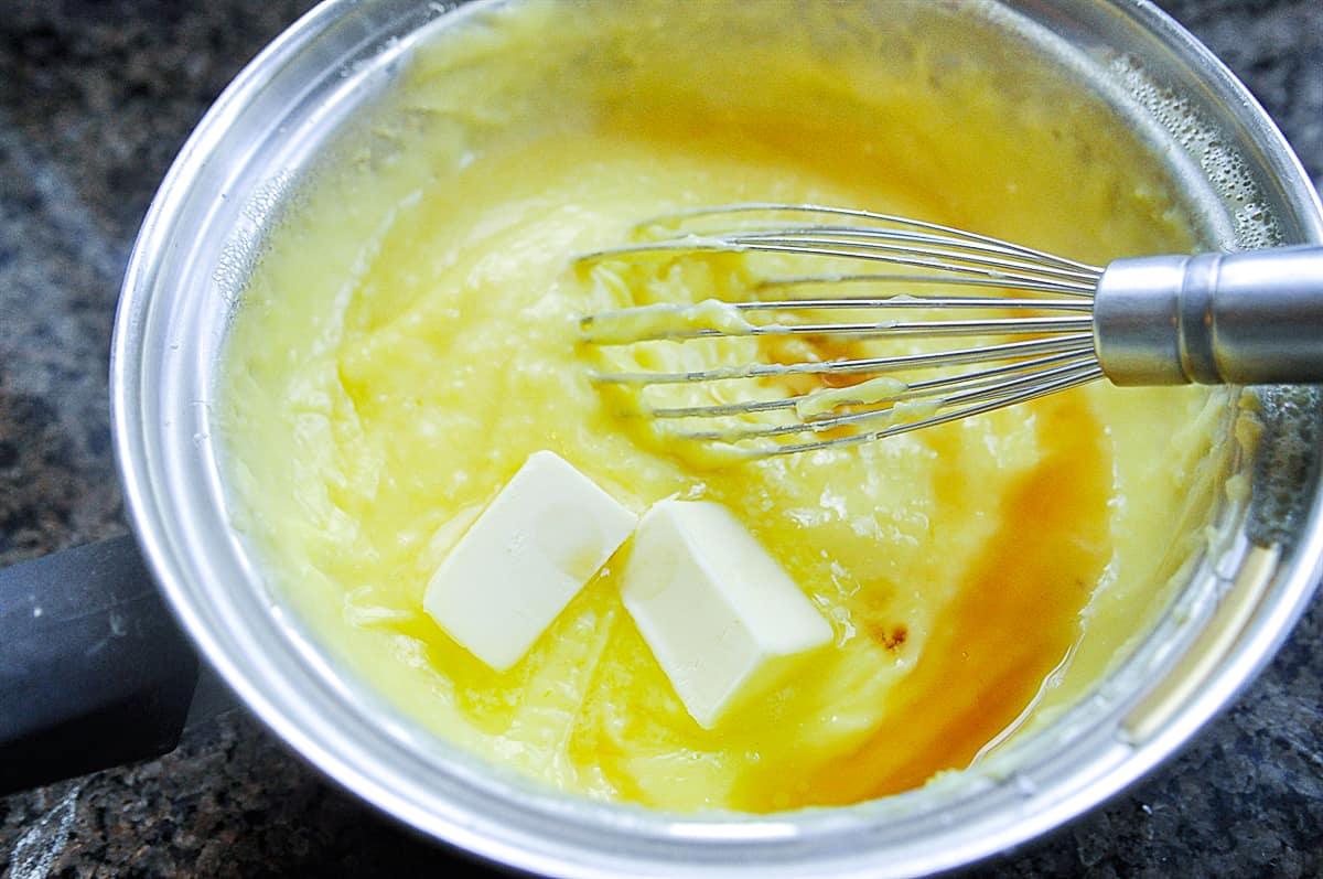 adding butter to pastry cream