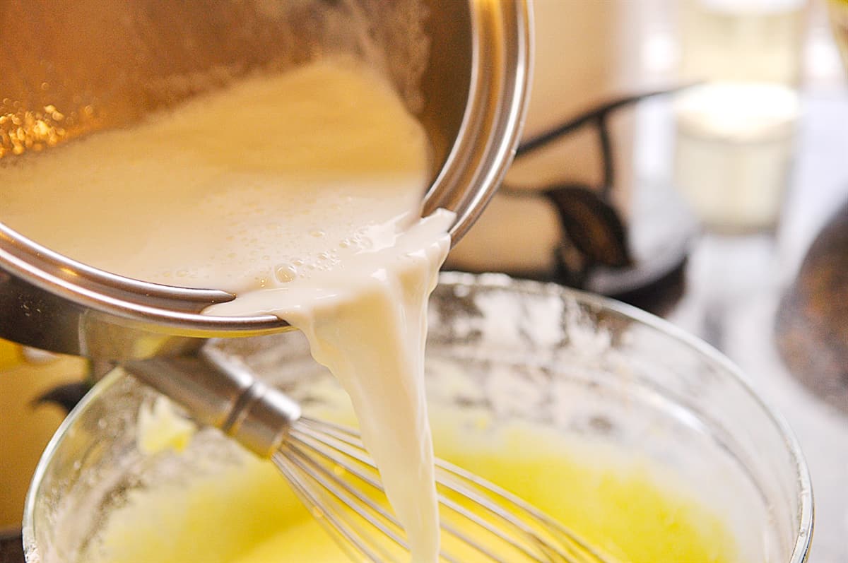 pouring milk into custard