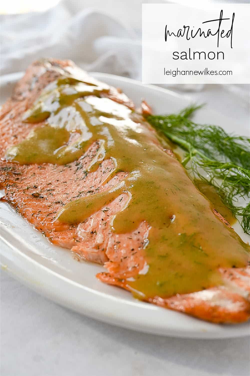 piece of marinated salmon with sauce on top