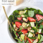 overhead shot of bowl of spinach salad