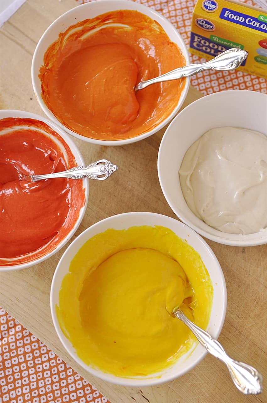 bowls of colored cake batter