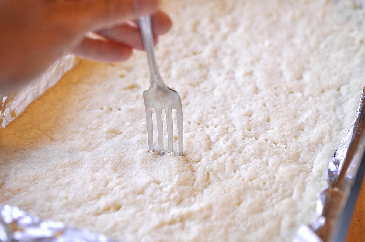 poking holes in shortbread with a fork