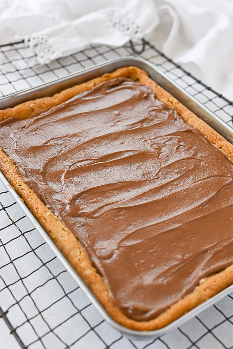 chocolate frosting on peanut butter bars