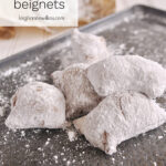 beignets on a baking sheet