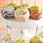 caramel apples on a cake plate